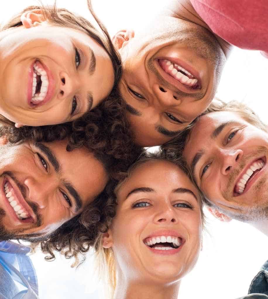 Smiling person showcasing white teeth after laser whitening treatment Bexley